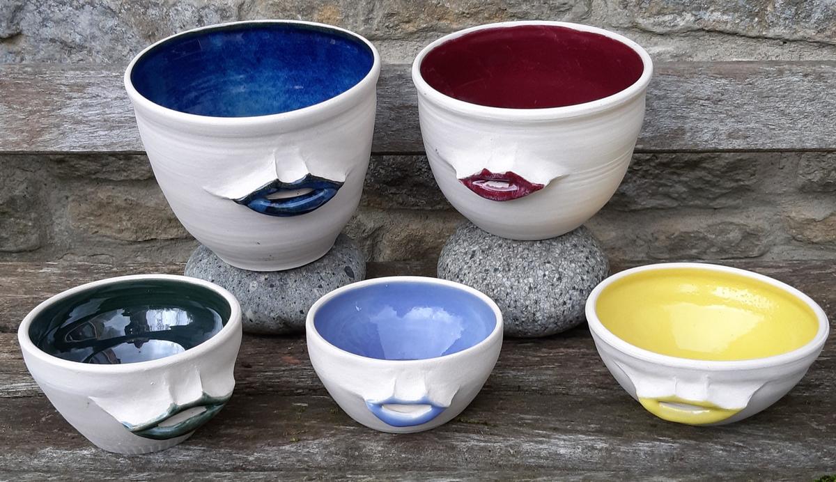 wheel-thrown colourful stoneware bowls with lips 