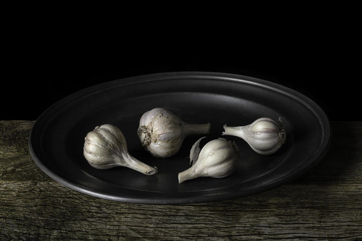 Garlic bulbs on a plate. 2021