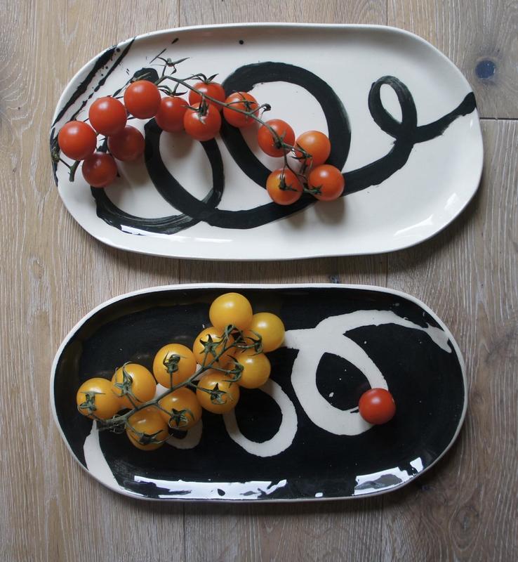 A pair of Earthenware Serving Dishes using Black Slip decoration.