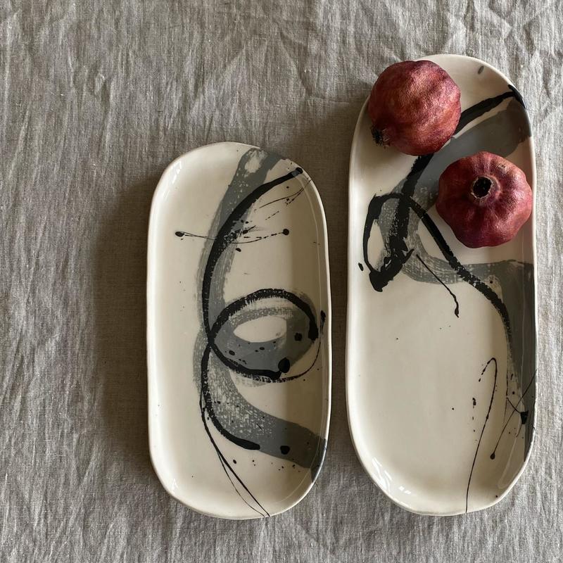 Earthenware serving platters with grey and black slip decoration