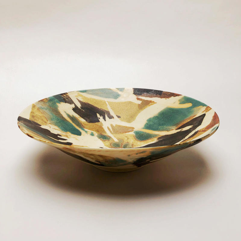 shallow porcelain bowl with abstract glazing