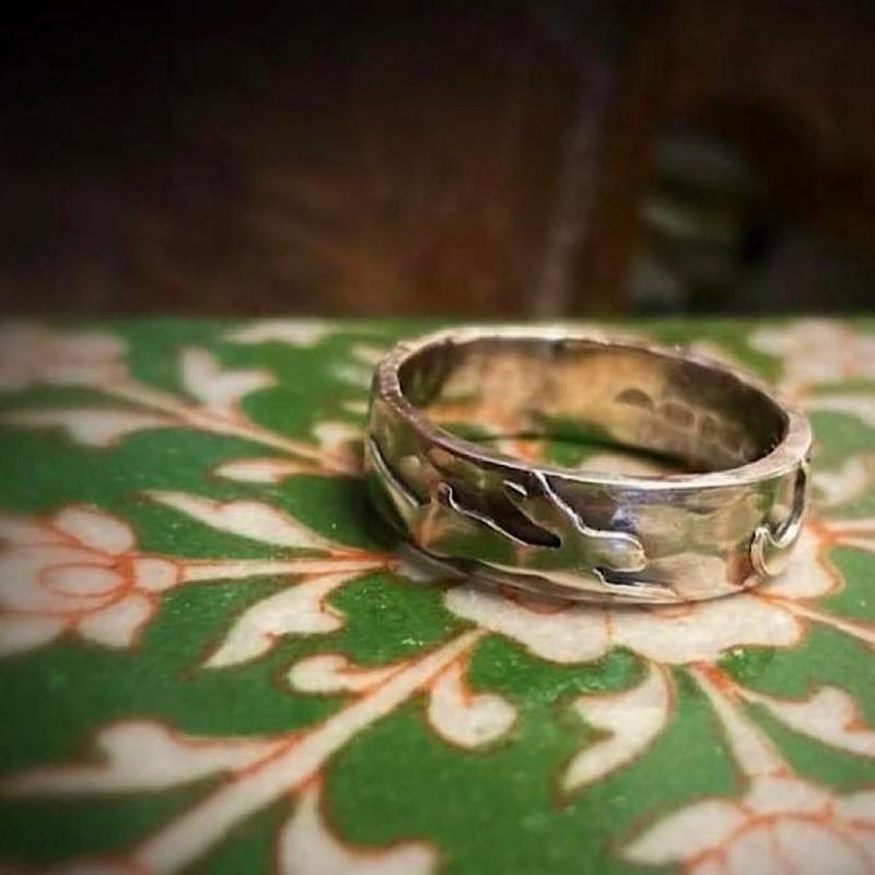 The Hare Ring.Heavy Silver band smithed over Sarsen stone and embellished with a hand fret cut Hare.