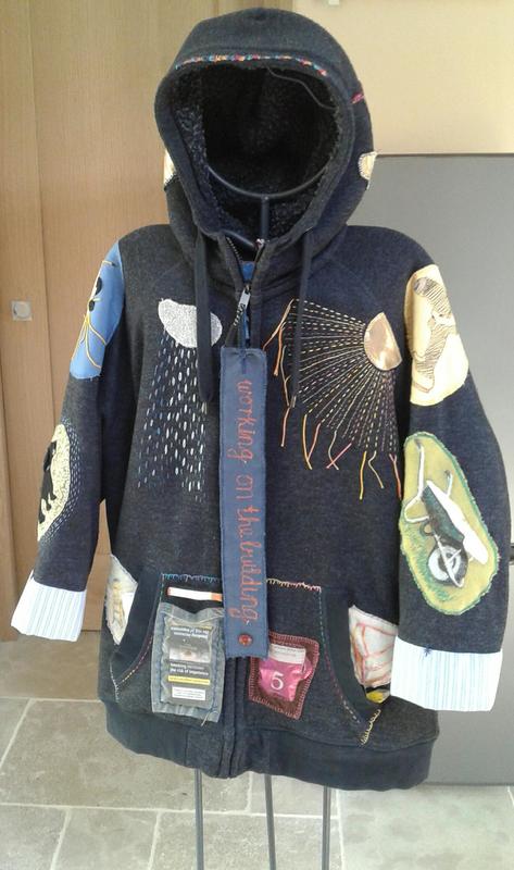 Appliqued and embroidered builders hoody describing the process of putting up Acer Studio.