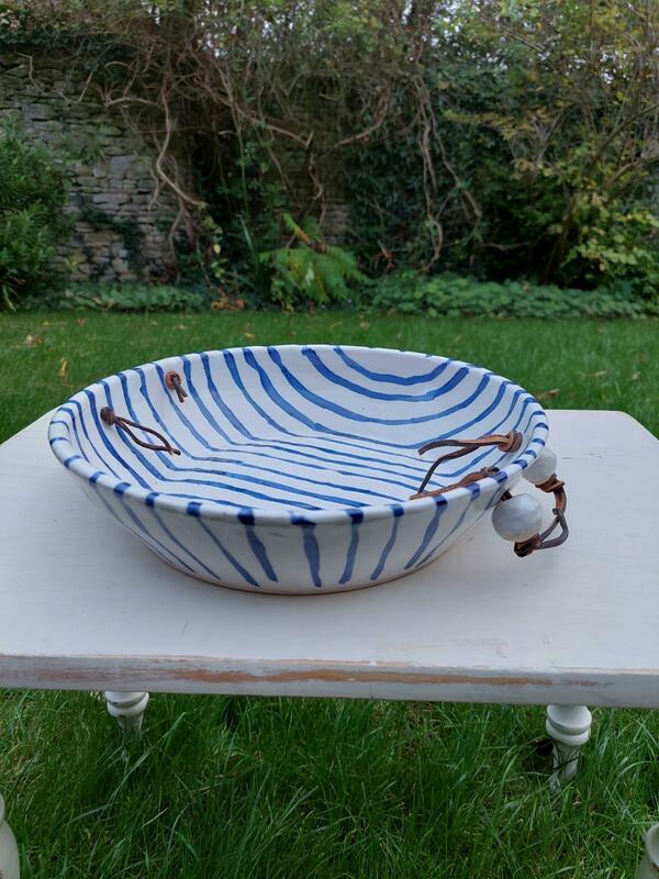 Large blue-striped open dish with ceramic/leather handles