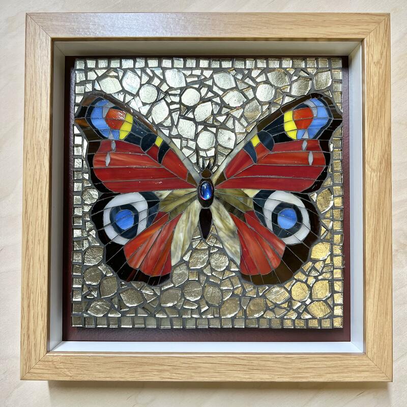 Peacock butterfly. 23cm squared. Glass on wood.