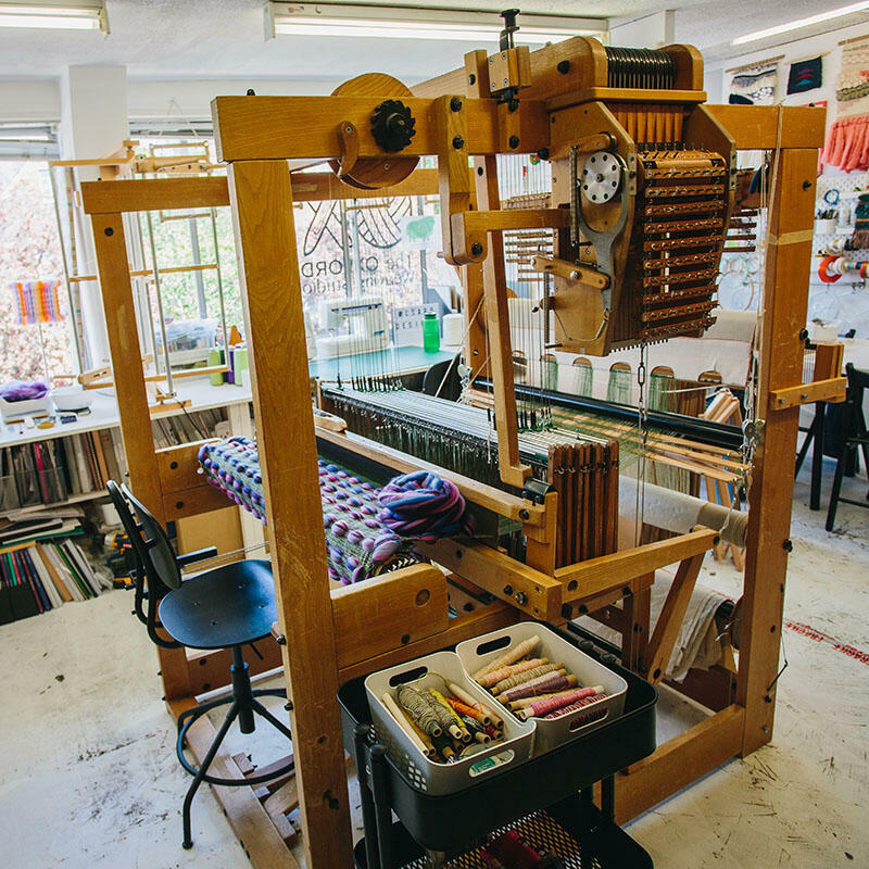 Cassandra Smith's studio featuring her AVL Dobby loom