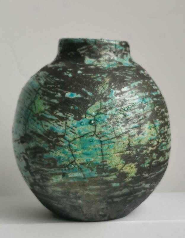 spherical pot -turquoise glaze on dark smoke background