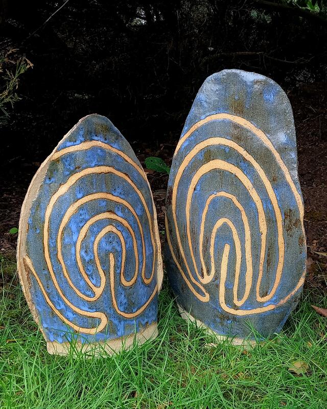 Ceramic standing stones in blue with ancient labyrinth design decoration