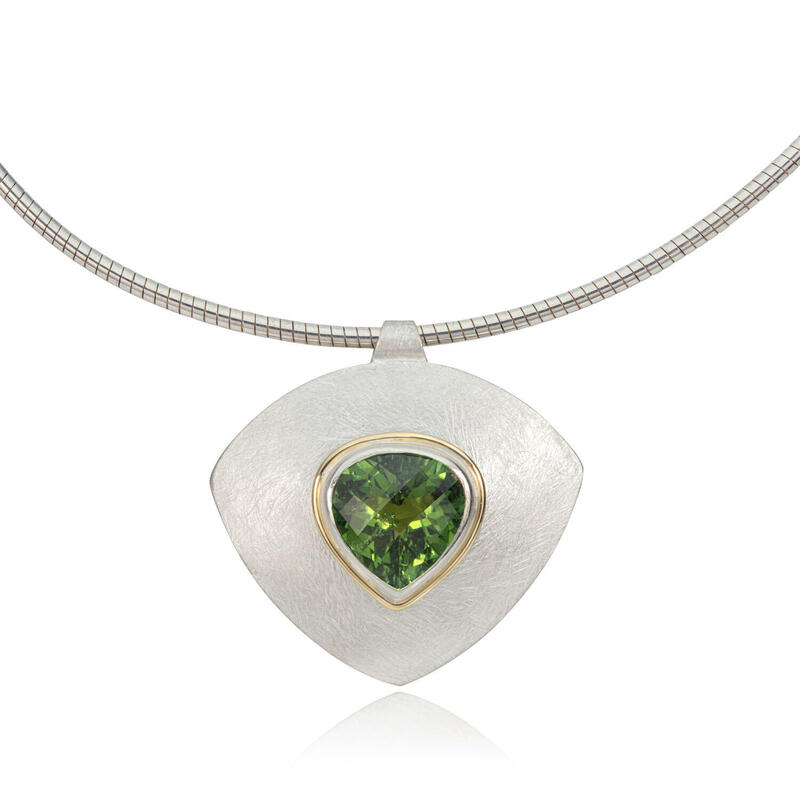  Silver, 18ct gold and green tourmaline pendant.