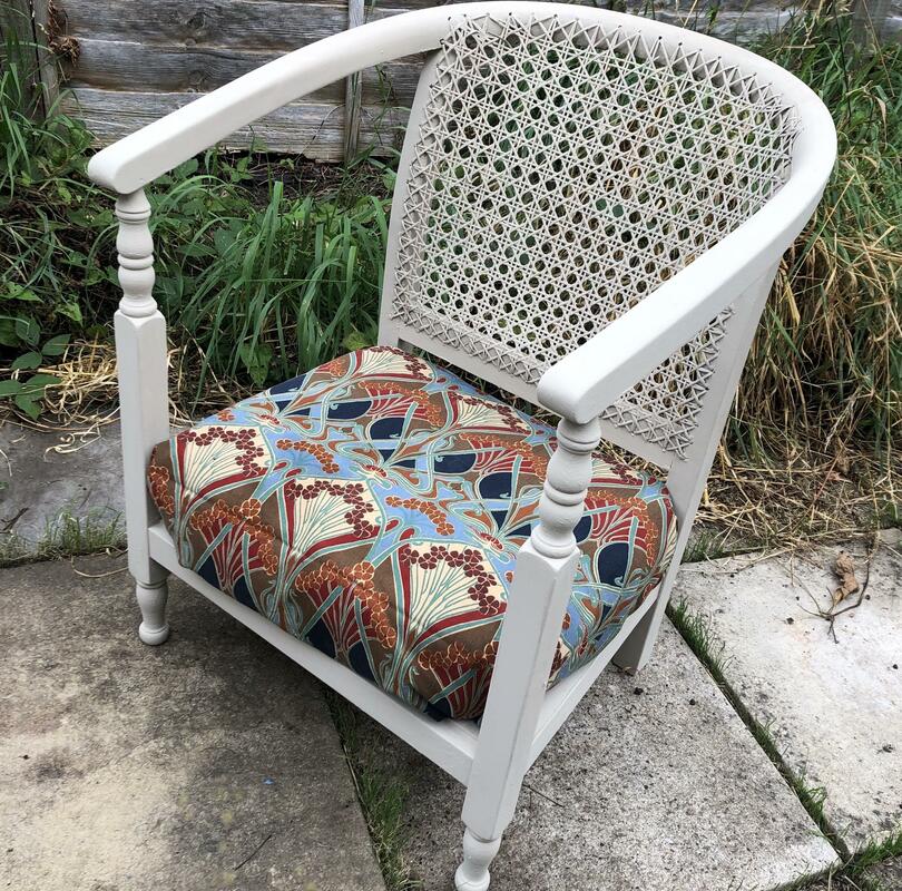 Reupholstered small armchair