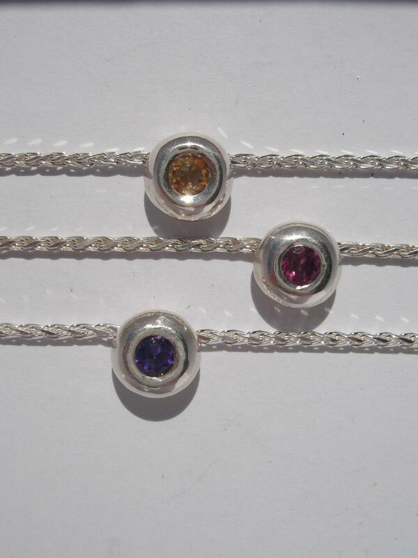 Silver pendants set with citrine, garnet and amethyst