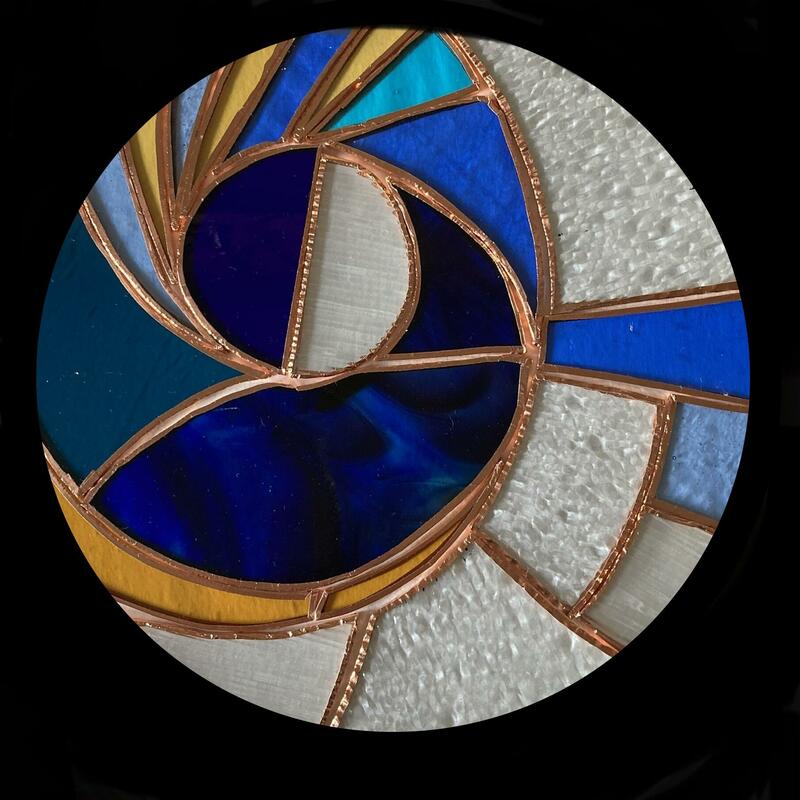 Copper Moon   .    A different process of glasswork is copper foil and this is a piece before solder is applied .
