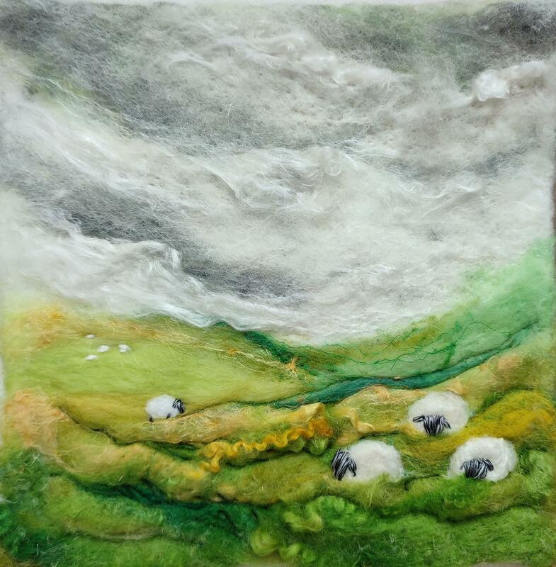 Felted wool and embroidery landscape with cloudscape and grazing sheep. Moody. 