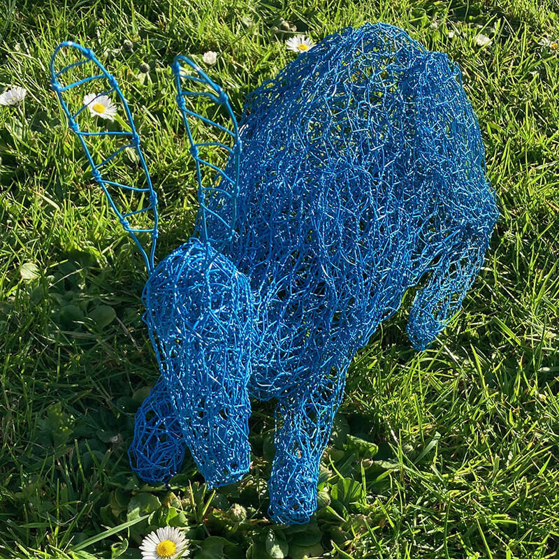 Little blue rabbit. Life-size painted wire garden sculpture.