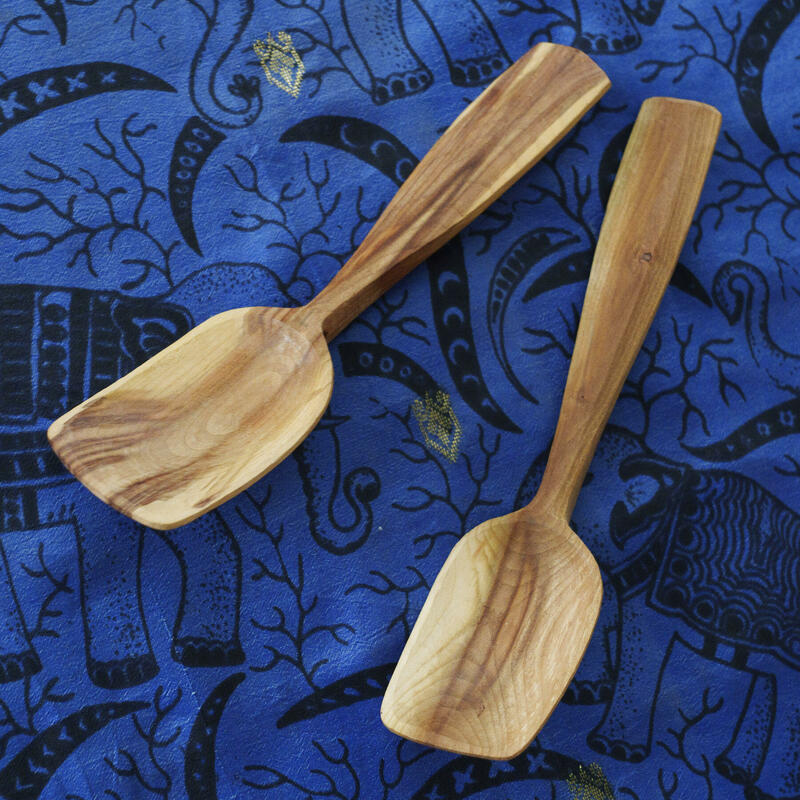 A pair of hand-carved wooden spoons from the same branch, in cherry wood, by Michael J. Amphlett