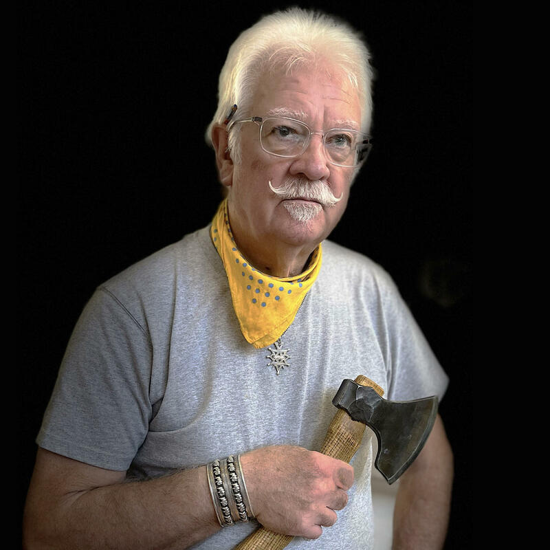 Michael J. Amphlett - Spoon carver, with a favourite axe, the 'Little Viking', hand-forged in Sweden by Svante Djarv. (Image by Yvonne Sonsino)