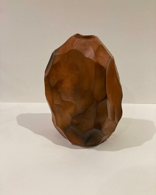 stone age tool form, burnished red clay, smoke-fired