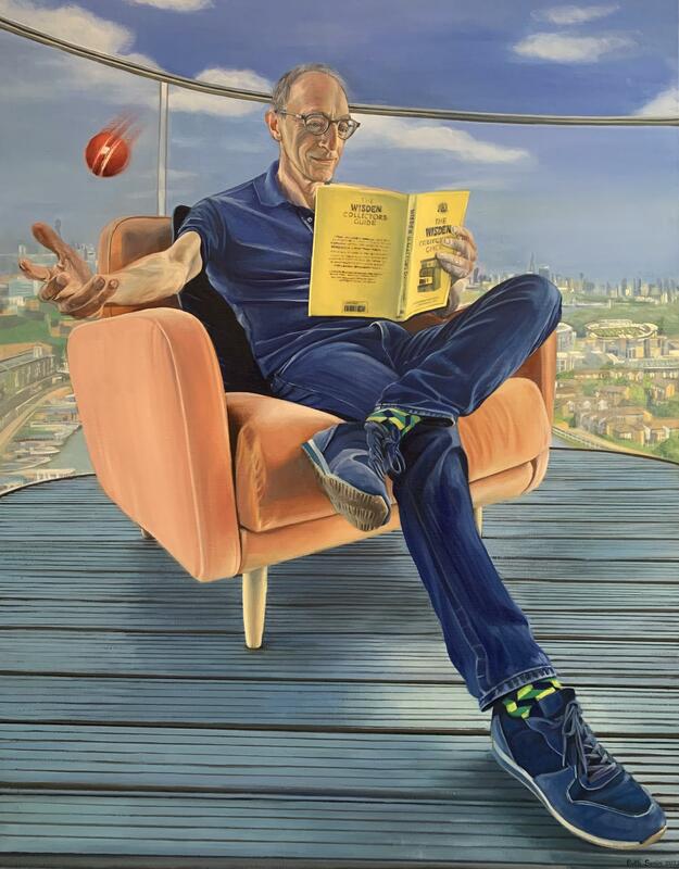 Portrait of man reading Wisden cricket book whilst catching a cricket ball