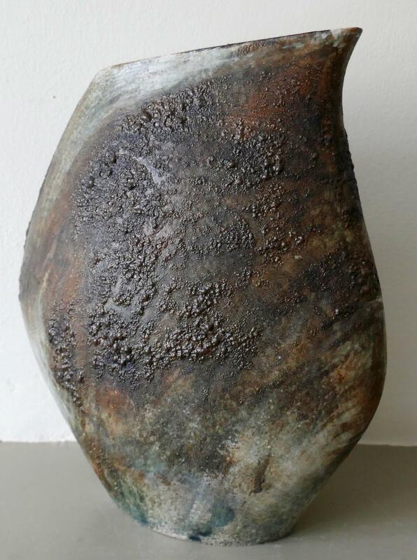 Coiled stoneware oval vessel.