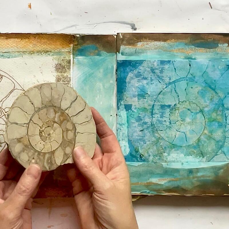Sketchbook image with ammonite print and the ammonite that inspired it