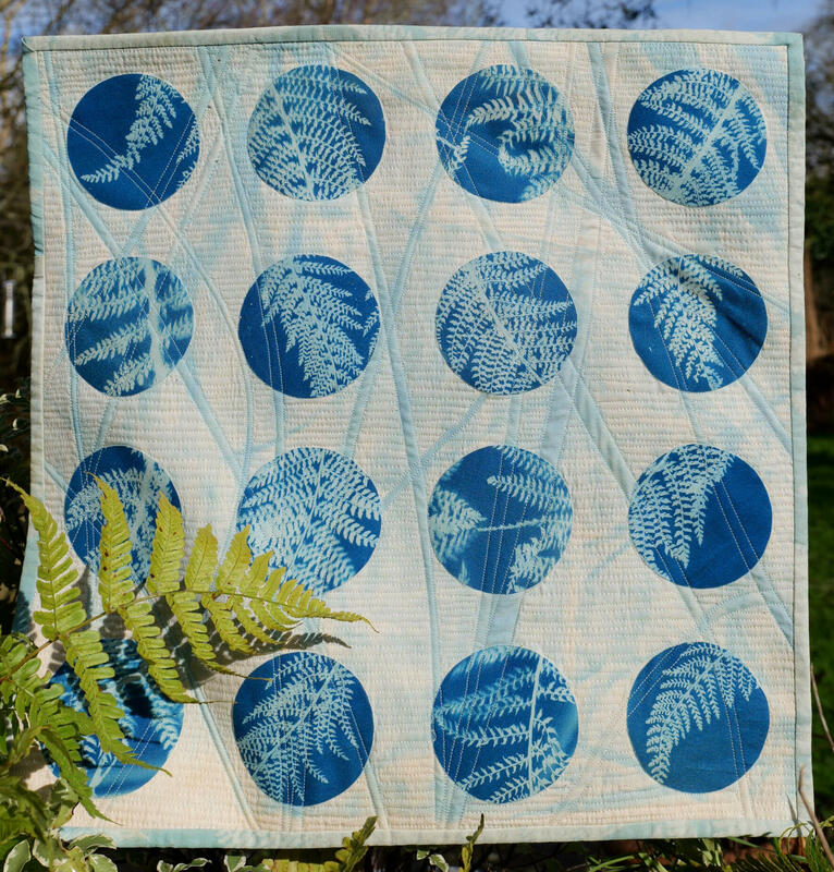 Ferny Blue Circles  -  43cm X  43  cyanotypes, free machine stitch on fabric with hanging sleeve  43cm X 43cm  £150