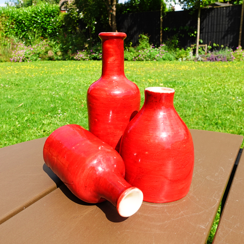 Bottles in red yb Blewbury Ceramics