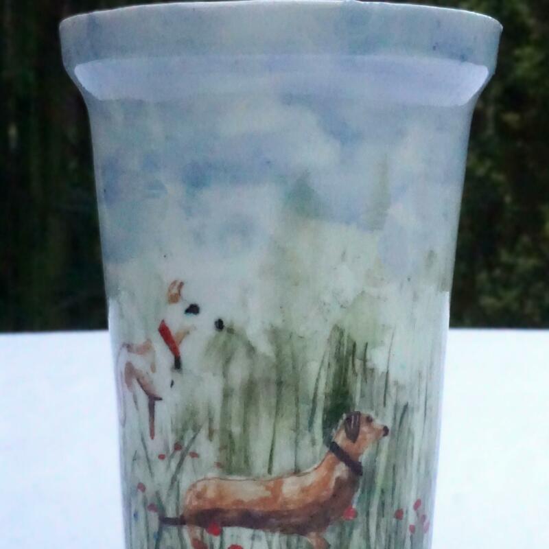 A hand painted vase depicting a whippet and dachhound
