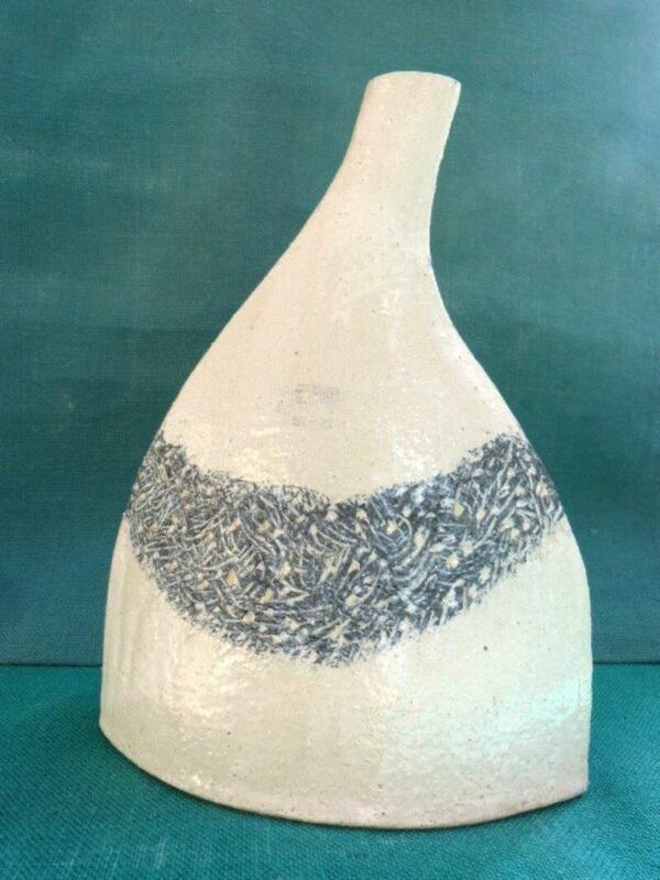 An asymetrical flask with an etched blue collar measuring 30cm tall.