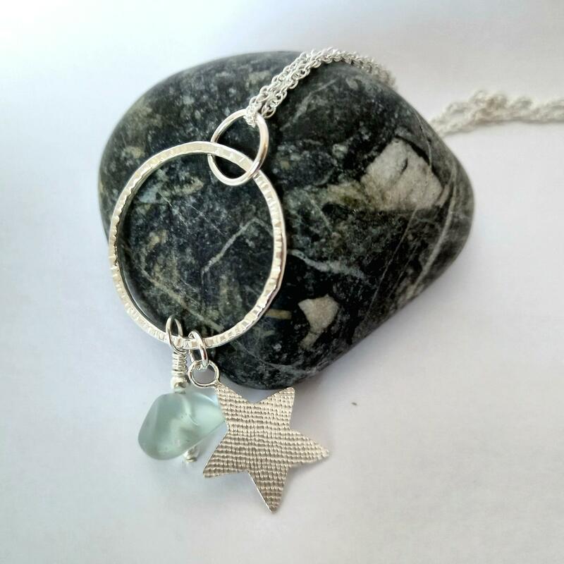 Silver pendant with star and sea glass