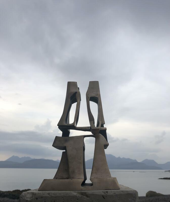 "Infinity", a seated human shape filled with sea, mountains and sky, bronze, 25 x 14 x 14 cm