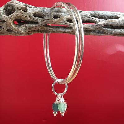 Linked hammered silver bangles with sea glass. Size medium.