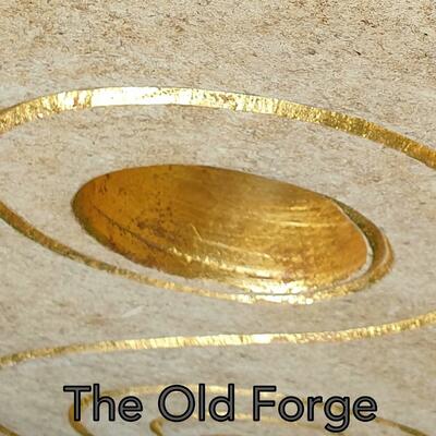 A swirl and void cut into Ancaster limestone, gilded with 24ct gold.