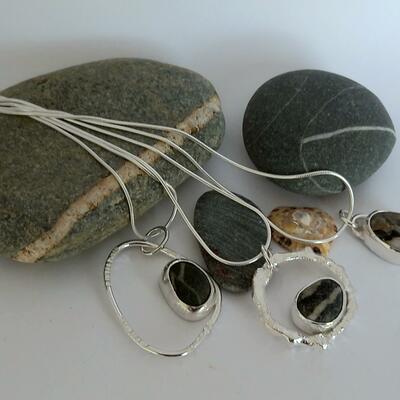 selection of beach pebble pendants