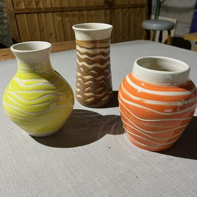 Vases decorated with brightly colored slip