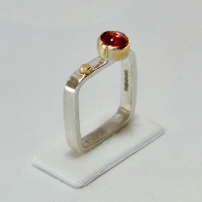 Square silver with garnet in gold setting