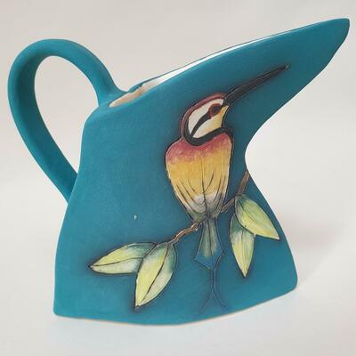Ceramic triangular exotic bird jug