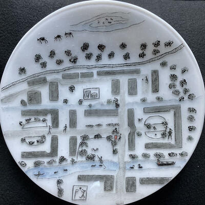 White glass dish with painted map