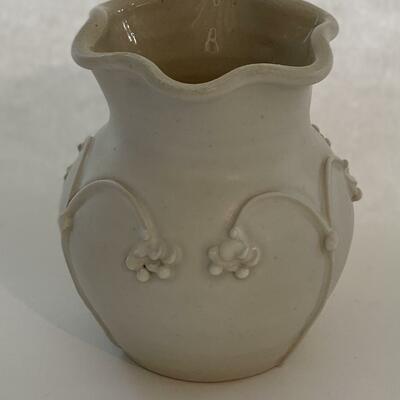 White stoneware vase with altered form