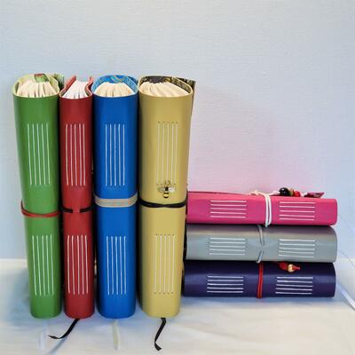 A selection of Hand Bound Leather Journals in bright colours.