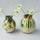 Two spherical ceramic vases in white, green and brown holdong white flowers