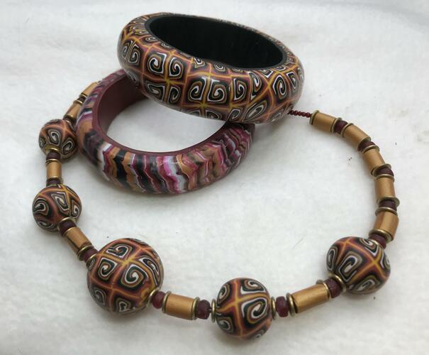 Jewellery made of hand crafted polymer clay beads   incorporating new and recycled beads.