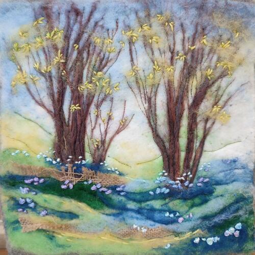 Landscape with budding trees and bluebells. Created with needle felted wool, embroidery and scrap fabric collage. Pretty.