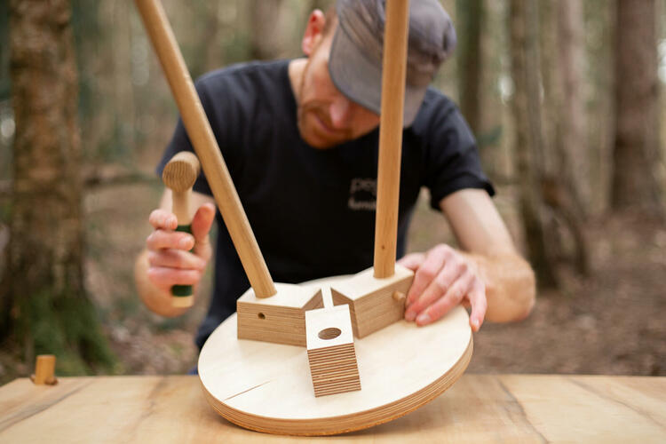 Designer Michael Buick assembling his Pegg Stool in Bagley Woods