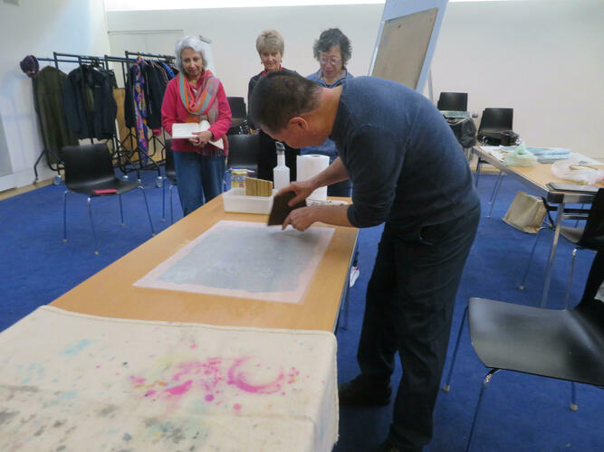 Members of Oxfordshire Chinese Brush Painting Group working with artist Qu Leilei in the Ashmolean Lecture Theatre 