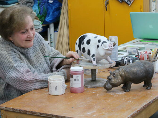 Glazing pottery animals in the studio
