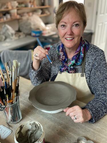 Jacqueline Elliot at work in Fired Up Studios