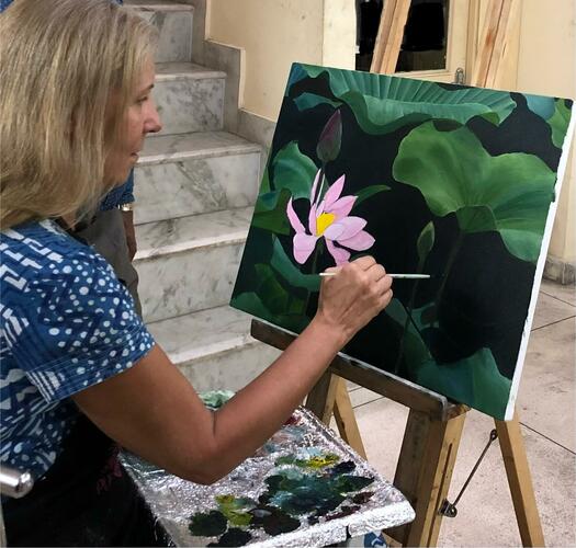 Artist painting lotus flowers