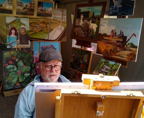 Tim Wait at work, painting in oils