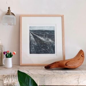 Kat Foxhall OPC: framed Wind in the Oats on a marble mantelpiece