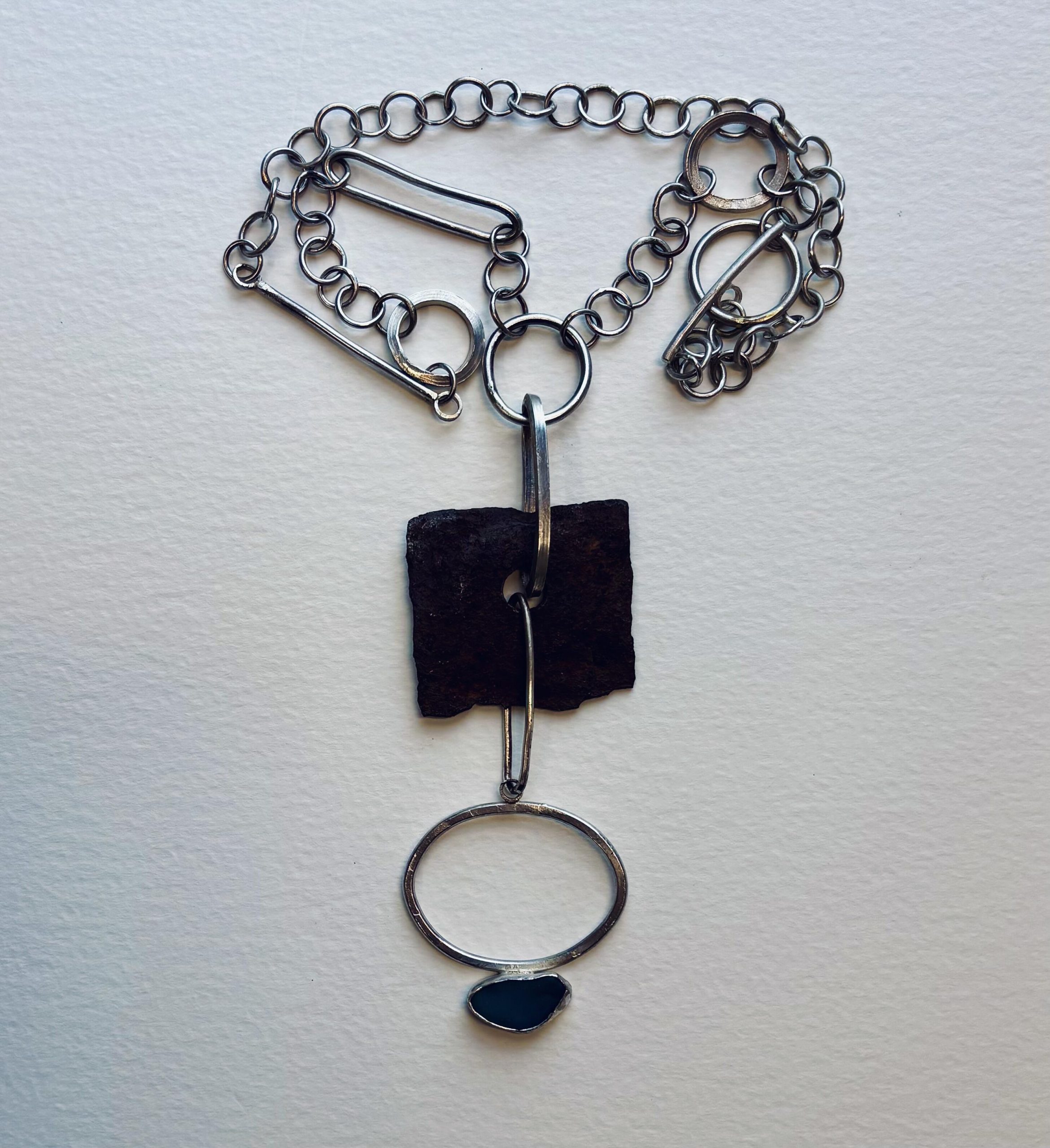 Jane Griffiths: Necklace of found metal and blue seaglass on a handmade sterling silver chain